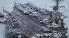 Aмериканский авианосец «Карл Винсон» прибывает на военно-морскую базу в Пусане, Южная Корея, 2 марта 2025 года