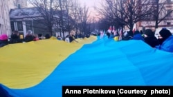 На акции протеста в Вильнюсе в третью годовщину войны России против Украины. 24 февраля 2025.