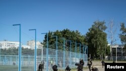 Полицейские на месте нанесения российского ракетного удара. Харьков, 8 мая 2024 г. 